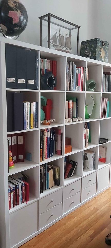 Book Shelf / Room Divider. Ikea Kallax shelf unit in white color. 