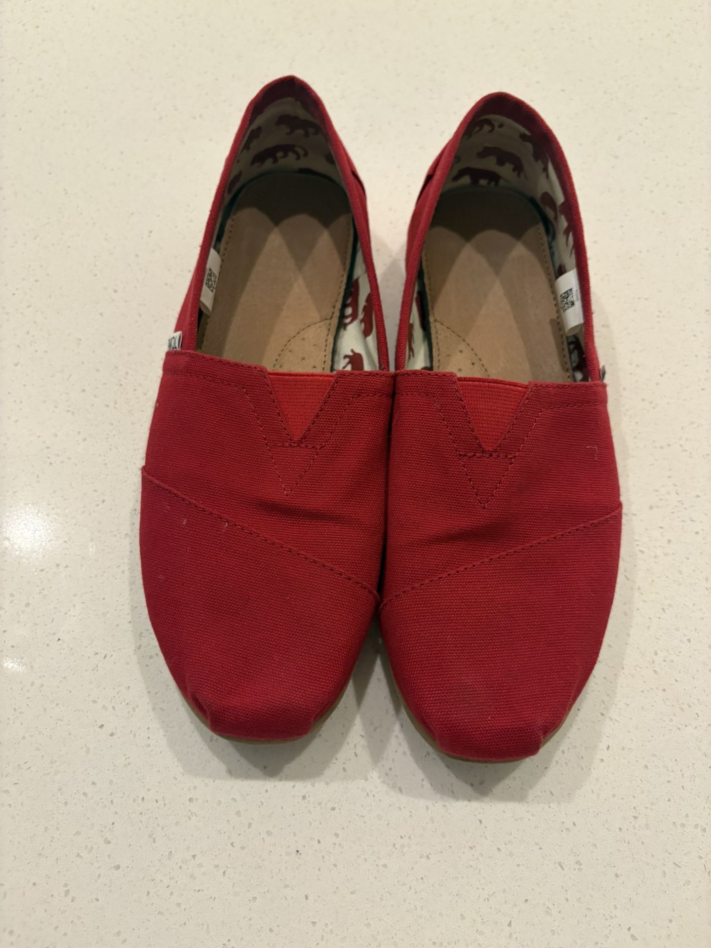 Women’s 9.5 Red Toms Slip Ons