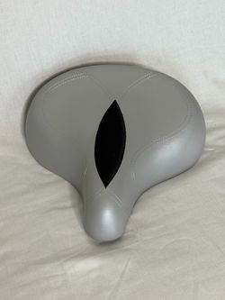 This is an Electra Vinyl Ergo Bike Saddle featuring a grey vinyl cover and a central anatomical cutout.
