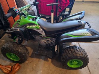 Boys ride on ATV