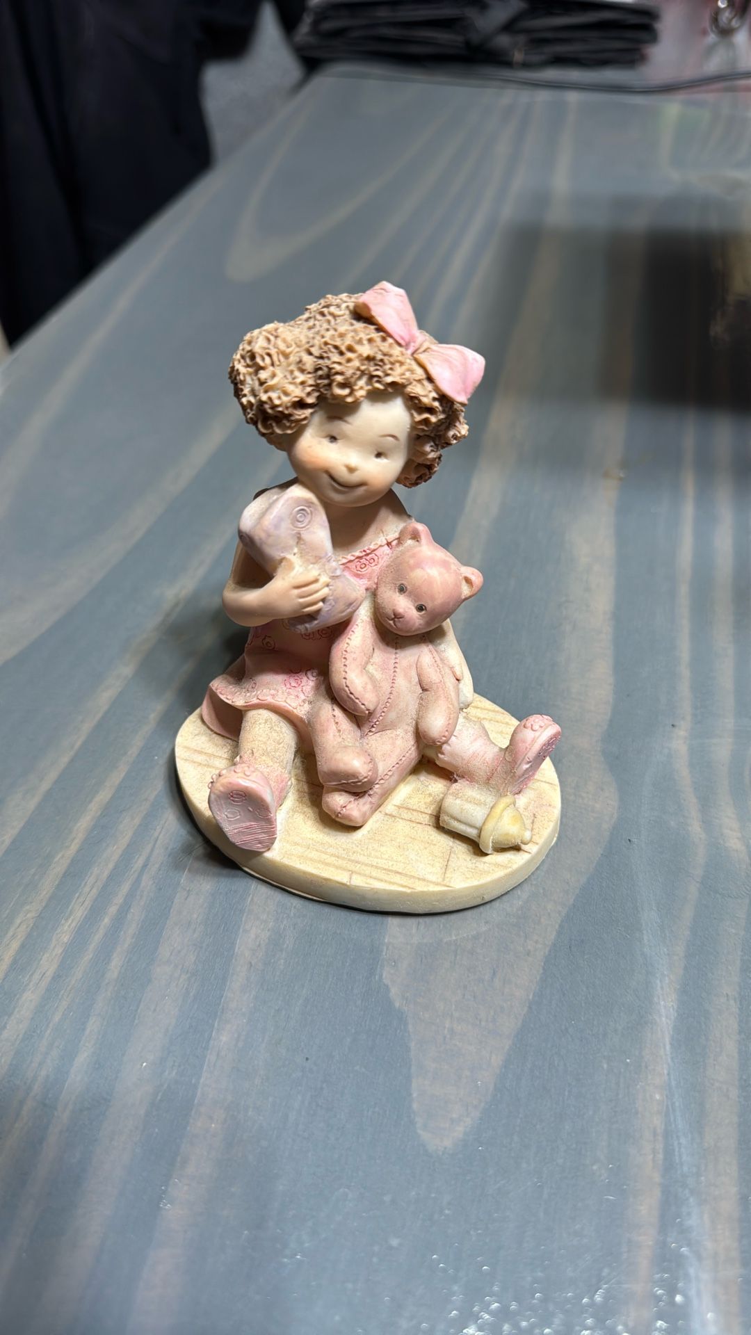 Little Girl With Bear Figuring