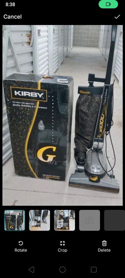 Kirby Vacuum cleaner and box of extra accessories
