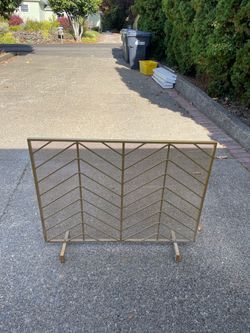 Gold colored fireplace screen