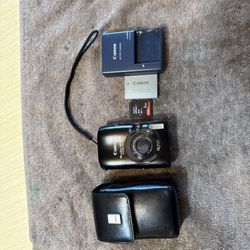 Canon PowerShot SD990 ELPH IS 14.7 MP 3.7 Optical Zoom Camera - Black with battery, memory card and charger. 