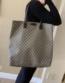Authentic Gucci large tote travel bag . Barely used and lining is in perfect condition. 17" by 6" by 18" great bag for travel 