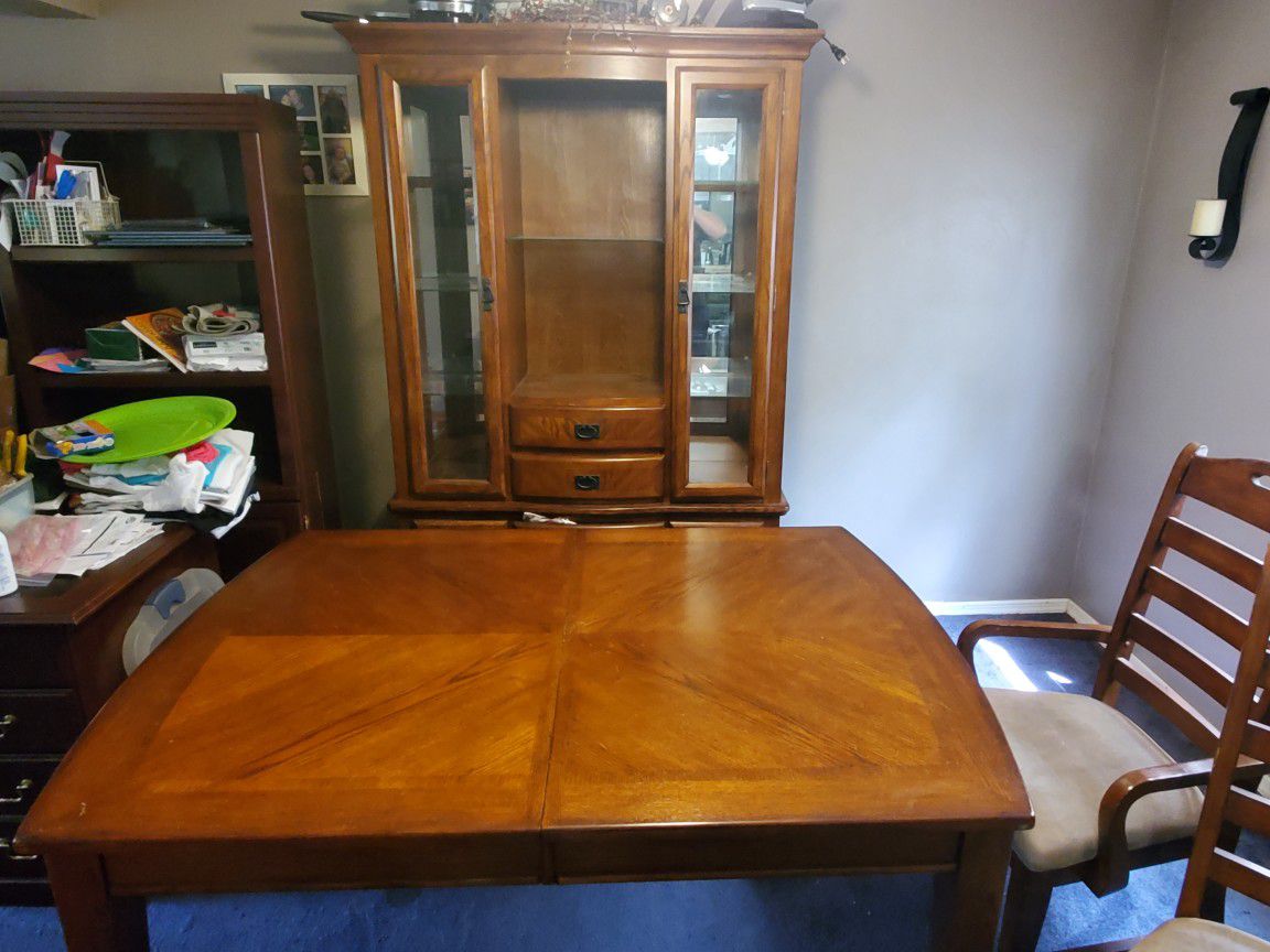 Nice table with center ext 6 chairs and china cupboard