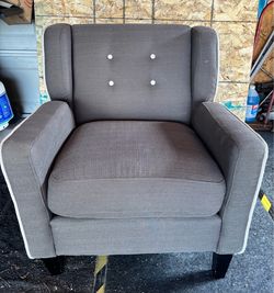 Gray Upholstered Armchair with Cream Button Tufting and Trim