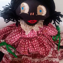  Nice antique black cloth doll with embroidered face.