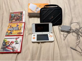Nintendo DSXL orange and white with three games, original box charger and case