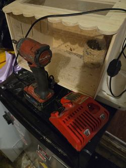 Milwaukee impact w/charger & 5.0 battery