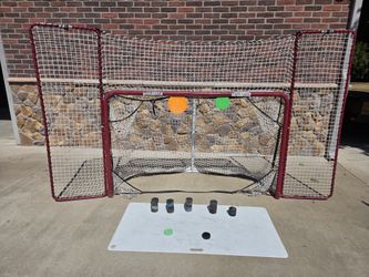 Hockey Net with pucks, targets and large shooting pad