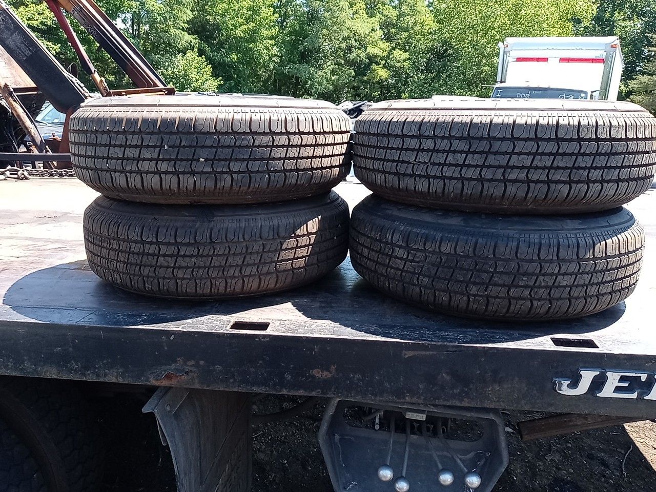 2000 chevy s10 pick up rims and new tires. 205 75 r15.