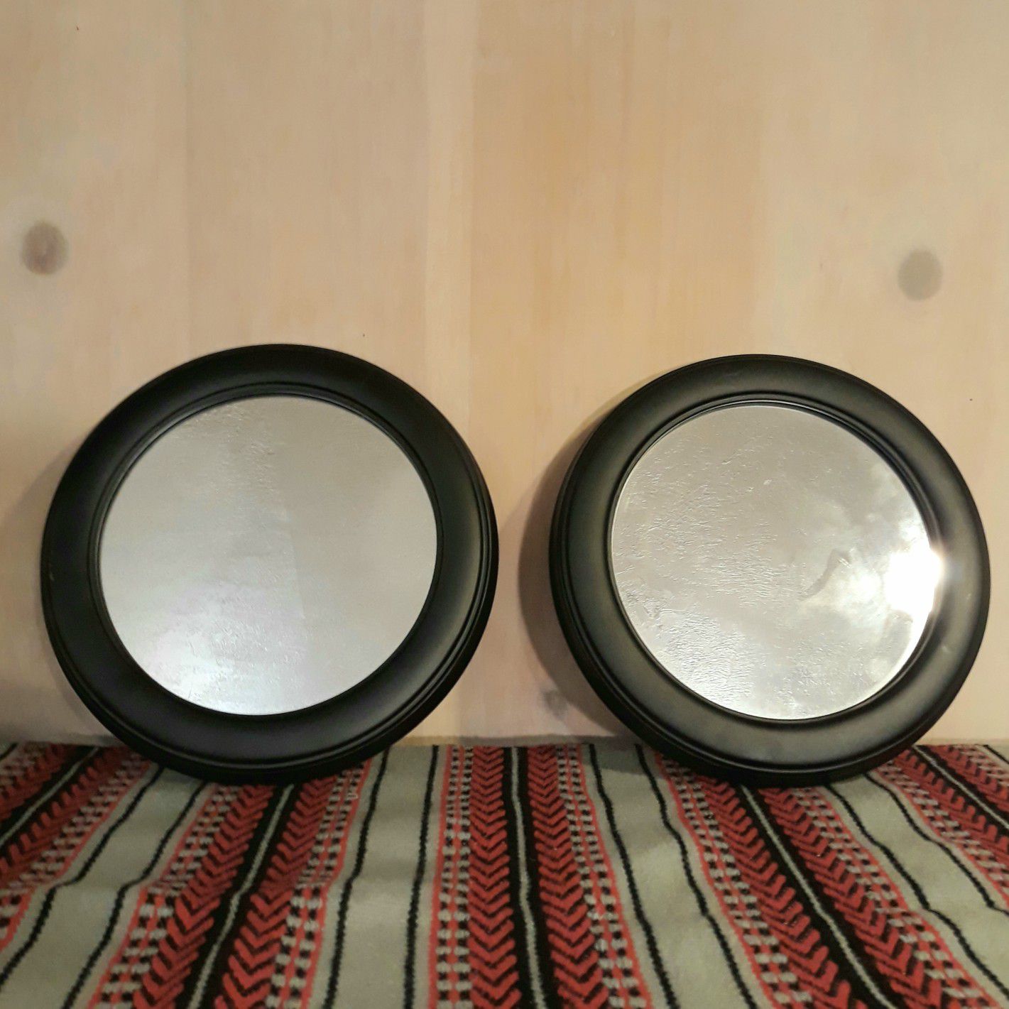 Round framed mirror pair