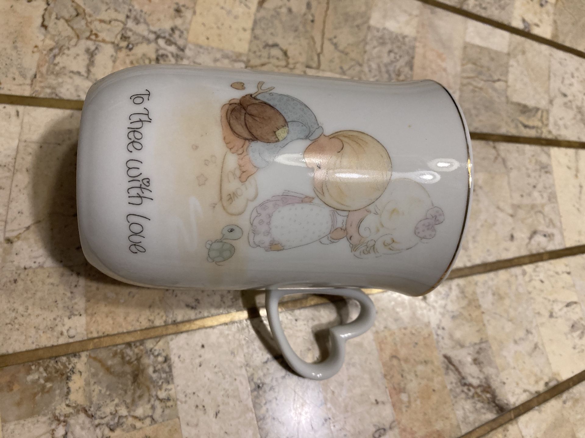 Precious moments decorative mug.