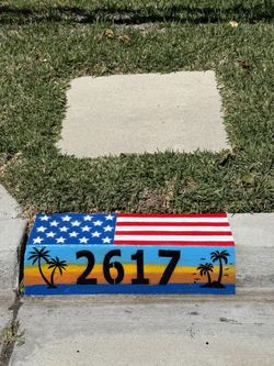 Curb Numbers Designed Sunset Scene With Big Flag On Top 