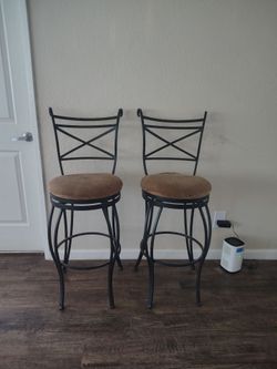 Two swivel bar stools