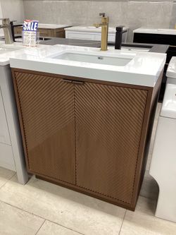 30” vanity, wood, acrylic top, fluted doors, available for pick up