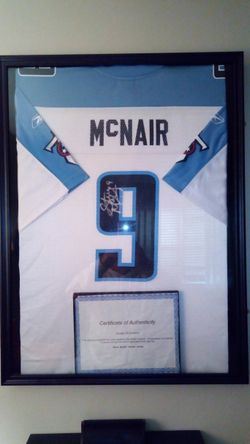 The late great Steve McNair custom framed sighned jersey with certificate of authinticity