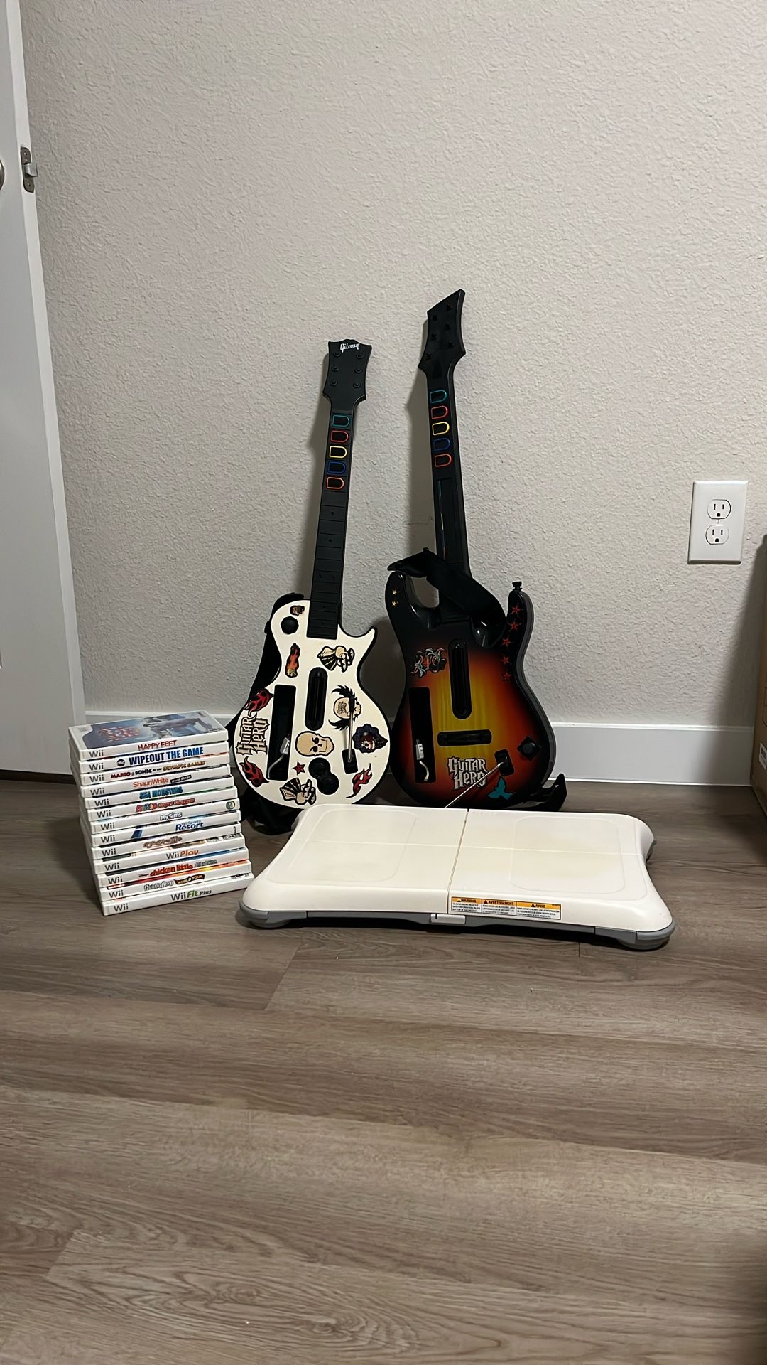 Nintendo Wii Game Bundle + Wii Fit Board + 2 Guitar Hero Guitars (Mario, Sports, Party Games)