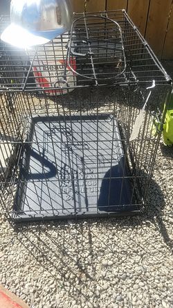 Foldable dog kennel with door and bass