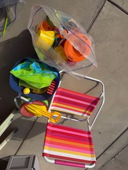 Beach chair and sand toys