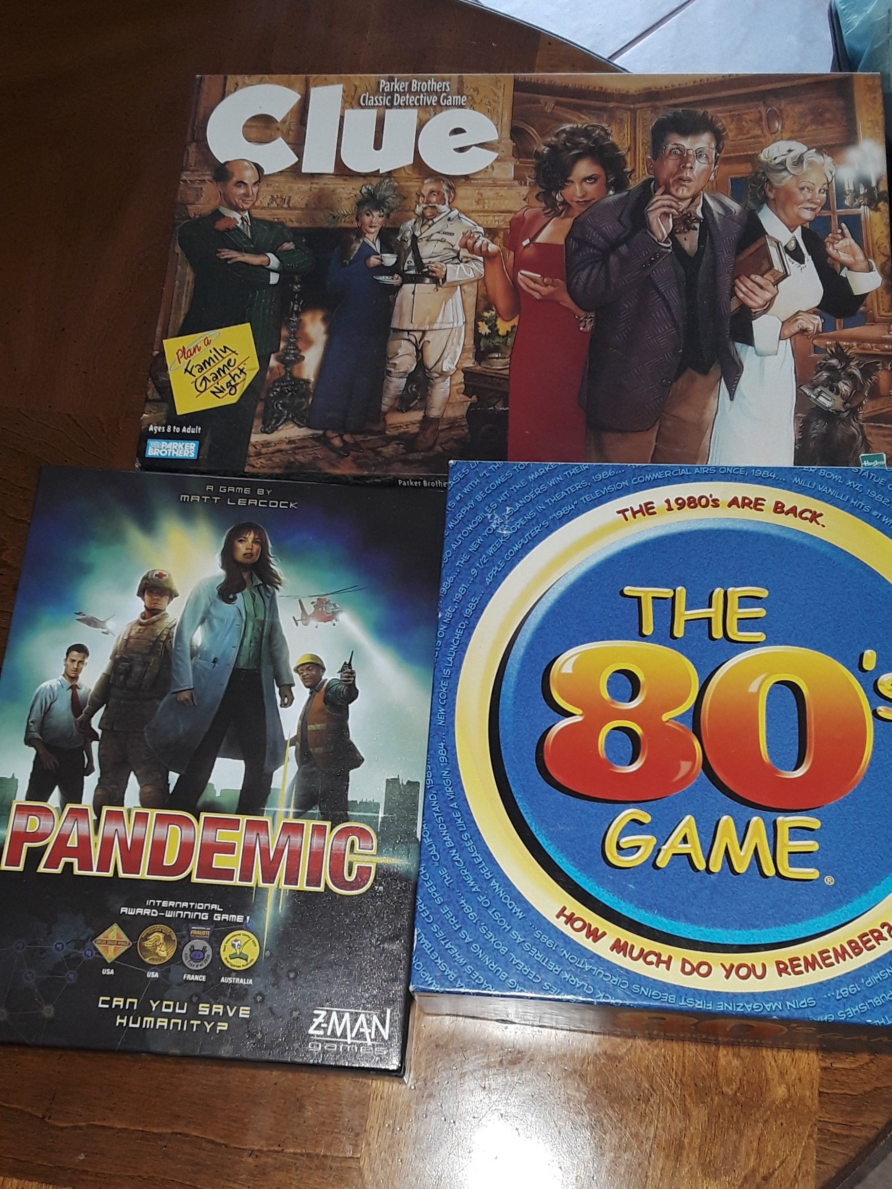 Board games (3) pandemic, 80's game & clue