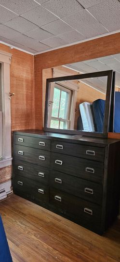 Hyndell Contemporary 8- Drawer Dresser from Signature Design by Ashley. It features a sophisticated silhouette with a rich espresso dark brown finish 