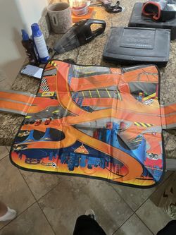 Both Packages Of Cars And Car Holder 