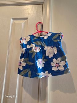 Blue floral babydoll top with ruffle sleeves