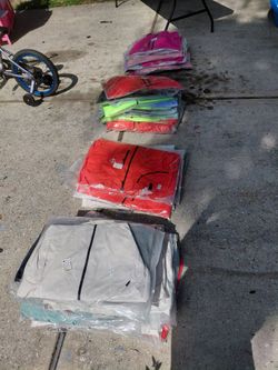 Huge lot of Women's swimsuits and rainproof windbreakers