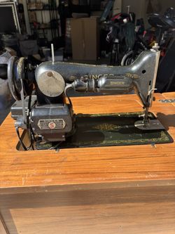 Vintage Singer Sewing Machine with Fold-Out Wooden Cabinet