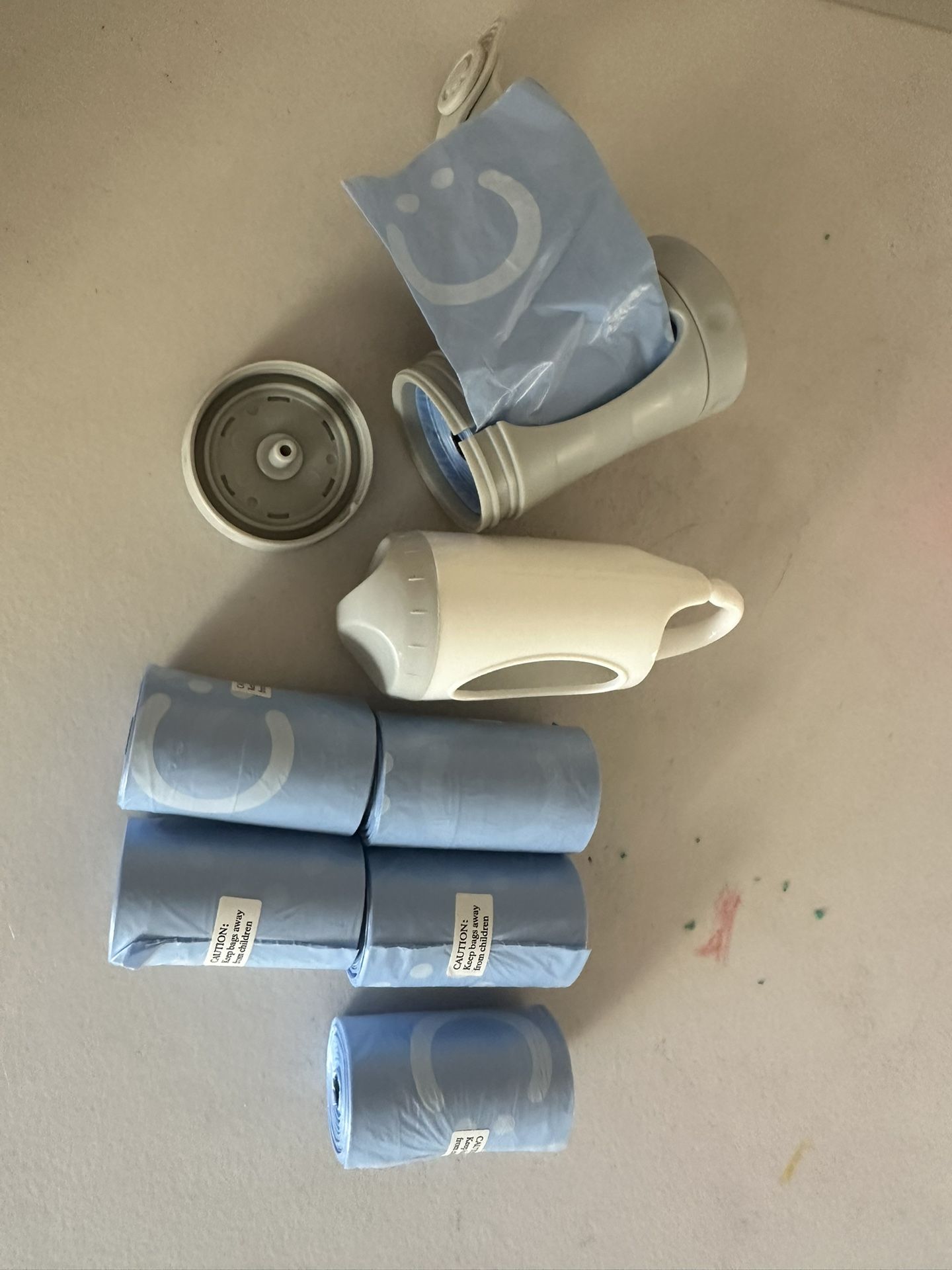 Ubbi On-the-Go Gray Bag Dispenser and Waste Disposal Bags Refill, 60 Lavender Scented Diaper Bags, Baby Savings Bundle +Munchkin Diaper Bag Dispenser