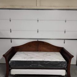 Twin Over Twin Trundle Bed Includes mattresses. The top mattress is brand new.