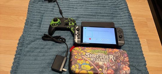 Nintendo switch oled with docking station, charger, extra controller and case. No trades cash only. No Zelle, Cash app Venmo, or PayPal check my other