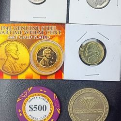Assorted gold and collectible coins and tokens.
