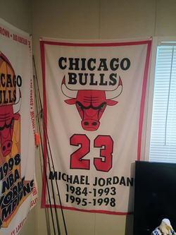 Michael Jordan and Scottie pippen retirement banners, all 6 bulls championship banners