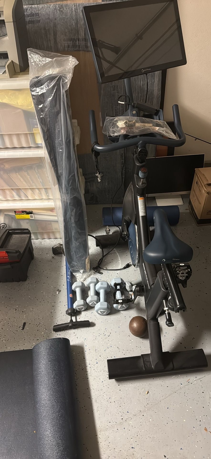 MYX fitness bike, yoga mats, foam roller, and weights