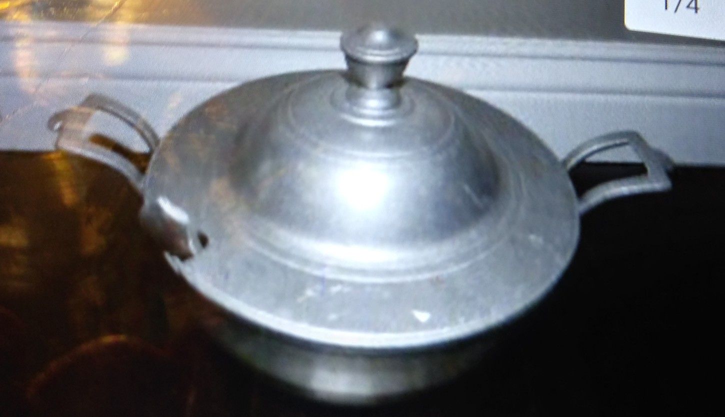 Silver soup dish with spoon and lid