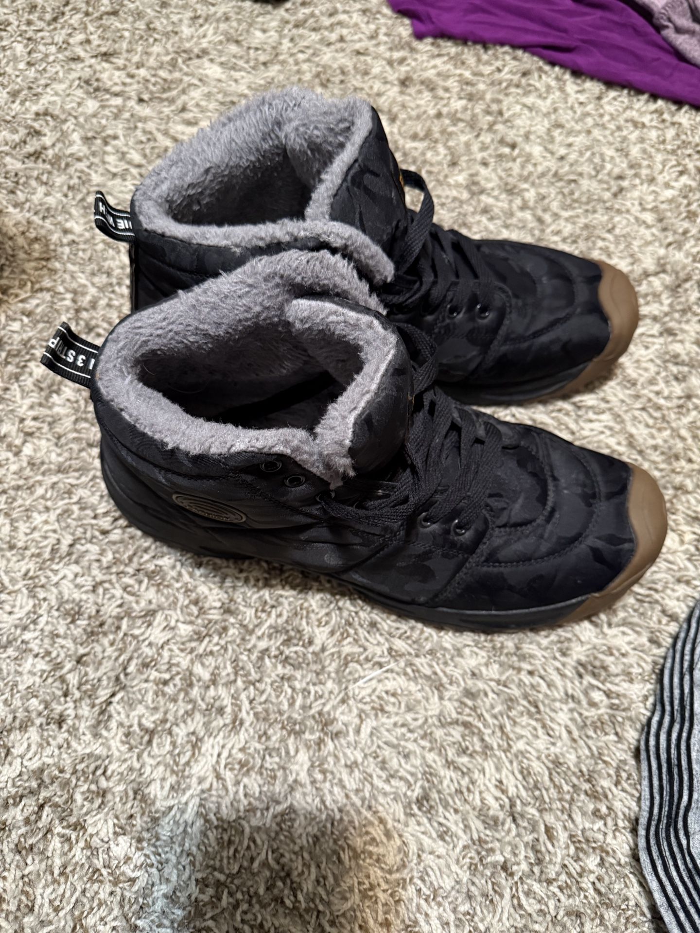 Black snow lined sneakers