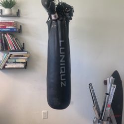 Punching Bag Filled With Leather Gloves 