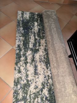Green white blue area rug