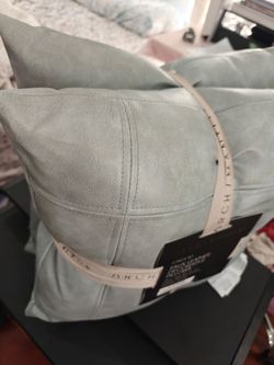 2-piece set of decorative pillows, faux leather. 18 inches by 18 inches.