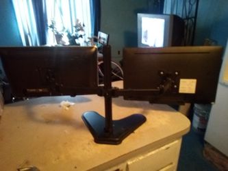 Dual monitor stand with monitors