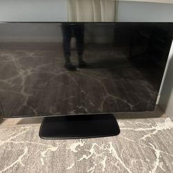 60-Inch TV with Metal Swivel Stand With Apple TV 