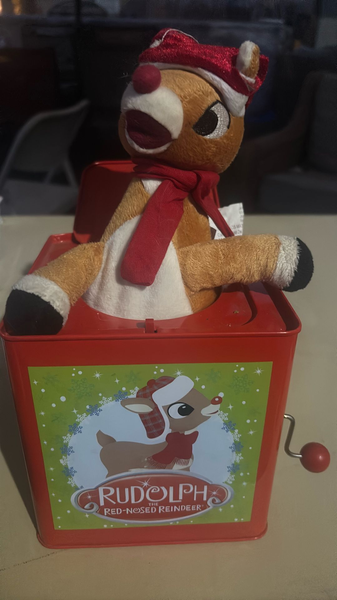 musical jack-in-the-box featuring the character Rudolph the Red-Nosed Reindeer