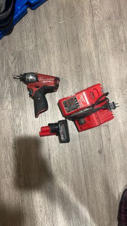 Milwaukee Fuel  Impact Drill And Charger And 1 Battery 