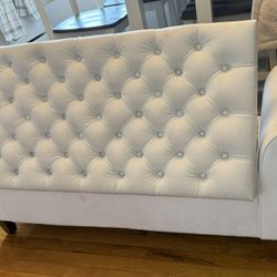 white upholstered velvety storage bench
