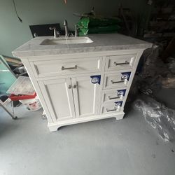 White 1 Inch Marble Sink With The Faucet For The Bathroom