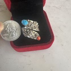 Vintage 925 Sterling silver genuine turquoise and coral bi pass ring , adjustable size , Native American, not signed , tested and guaranteed . Has squ
