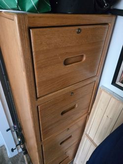 DRESSER: Tall Skinny dresser with 4 deep

drawers
